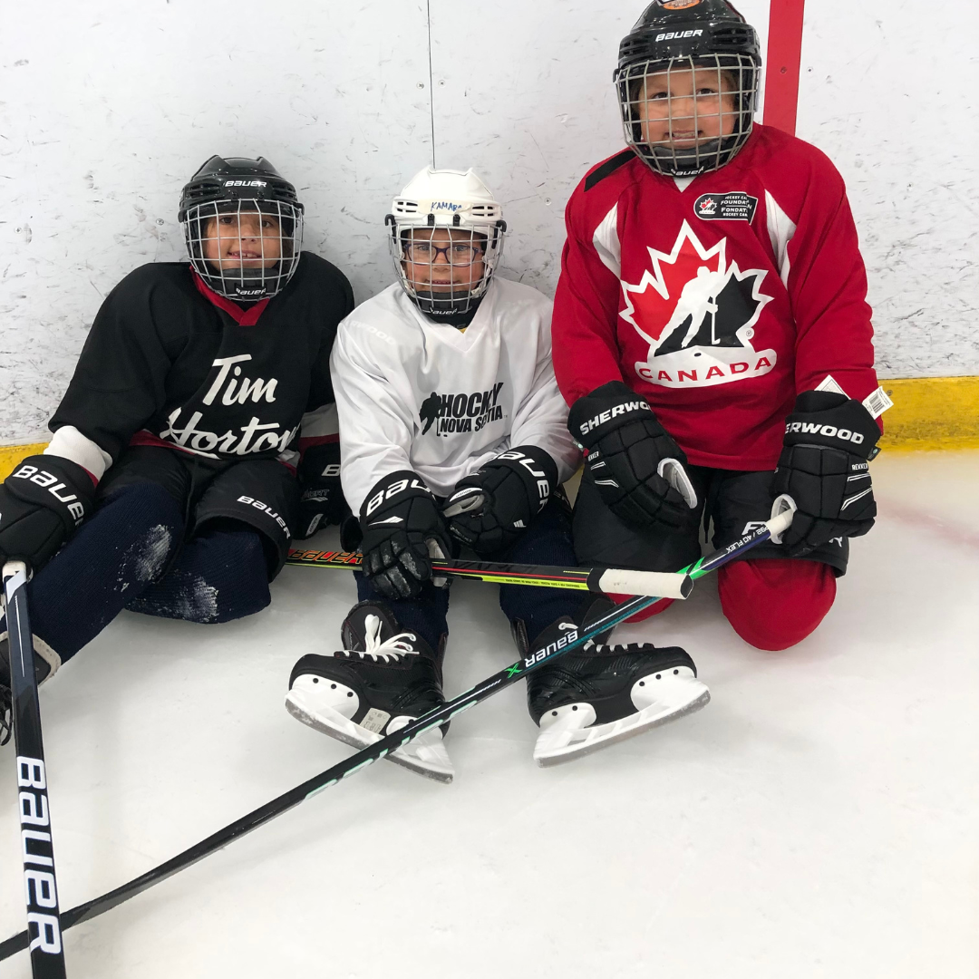Female hockey players from the Female Indigenous Hockey Program